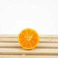 The tasty fresh orange half on wooden tray Royalty Free Stock Photo