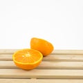 The tasty fresh orange half on wooden tray Royalty Free Stock Photo