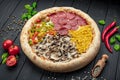 Tasty fresh pizza with four different pieces in one on wooden background. Top view of big pizza Royalty Free Stock Photo