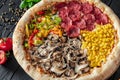 Tasty fresh pizza with four different pieces in one on wooden background. Top view of big pizza Royalty Free Stock Photo