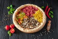 Tasty fresh pizza with four different pieces in one on wooden background. Top view of big pizza Royalty Free Stock Photo