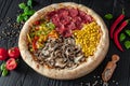 Tasty fresh pizza with four different pieces in one on wooden background. Top view of big pizza Royalty Free Stock Photo