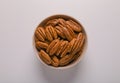 Tasty fresh ripe pecan nuts on white background, top view