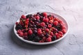 Tasty fresh ripe raspberry, blackberry, gooseberry and red currant berries in plate, healthy food fruit Royalty Free Stock Photo