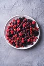 Tasty fresh ripe raspberry, blackberry, gooseberry and red currant berries in plate, healthy food fruit Royalty Free Stock Photo