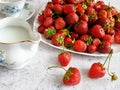 Tasty fresh strawberry with milk sour cream or yogurt closeup, dessert with strawberries