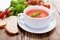 Tasty fresh tomato soup basil and bread Royalty Free Stock Photo