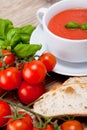 Tasty fresh tomato soup basil and bread Royalty Free Stock Photo