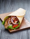 Tasty fresh wrap sandwich with chicken and vegetables Royalty Free Stock Photo