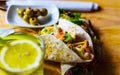 Tasty fresh wrap sandwich with meat, vegetables and cheese, deli Royalty Free Stock Photo