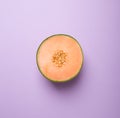 Tasty fresh yellow appetizing cut melon pastel background Royalty Free Stock Photo