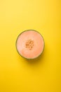 Tasty fresh yellow appetizing cut melon pastel background Royalty Free Stock Photo