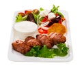 Tasty fried balkan kebapcheta served with salad of greens and b