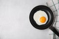 Tasty fried egg in pan on light grey table, flat lay. Space for text Royalty Free Stock Photo