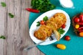 Tasty fried hot sandwiches with minced chicken on a white plate. A piece on a fork. The top view Royalty Free Stock Photo