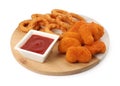 Tasty fried onion rings, chicken nuggets and ketchup isolated on white Royalty Free Stock Photo