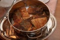 Tasty fried pieces of carp fish in a metal pot. Dishes prepared for the holidays Royalty Free Stock Photo