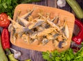 Tasty fried Trachurus on a wooden board Royalty Free Stock Photo