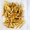 Tasty fries on white wooden surface, top view, close up. Flat lay Royalty Free Stock Photo