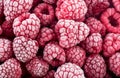 Tasty frozen raspberries as background, top view. Ripe raspberries with frosty freshness.