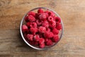 Tasty frozen raspberries on wooden table, top view Royalty Free Stock Photo