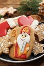 Tasty gingerbread cookies on table, closeup. St. Nicholas Day celebration