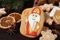 Tasty gingerbread cookies on wooden table, closeup. St. Nicholas Day celebration