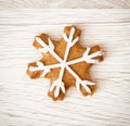 Tasty gingerbread star, wooden background