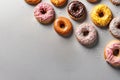 Tasty glazed donuts on grey background. Space for text. Sweet food, calories, holiday, birthday.