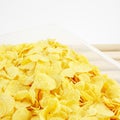 The tasty golden corn flakes in plastic container box