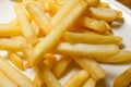 Tasty golden french fries on a plate.
