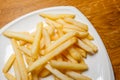 Tasty golden french fries on a plate.