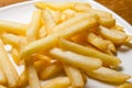 Tasty golden french fries on a plate.