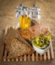 Tasty grain bread with olives, oil and spices Royalty Free Stock Photo