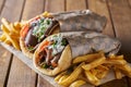 Tasty greek gyros with fries with feta cheese and tzattziki sauce Royalty Free Stock Photo