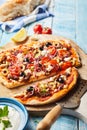 Tasty Greek pizza with olives, feta cheese, tomato