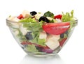 Tasty greek salad in transparent bowl