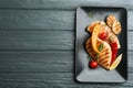 Tasty grilled chicken fillets with vegetables on grey wooden table, top view. Space for text Royalty Free Stock Photo