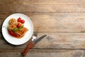 Tasty grilled chicken fillets with vegetables served on wooden table, flat lay. Space for text Royalty Free Stock Photo