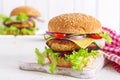 Tasty grilled homemade hamburger with burger chicken, tomato, cheese Royalty Free Stock Photo