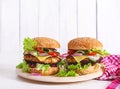 Tasty grilled homemade hamburger with burger chicken, tomato, cheese Royalty Free Stock Photo