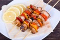 Tasty grilled meat and vegetables on skewer Royalty Free Stock Photo