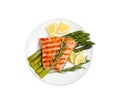 Tasty grilled salmon with asparagus, lemon and rosemary on white background, top view Royalty Free Stock Photo