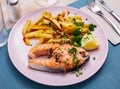 Tasty grilled salmon served with french fries Royalty Free Stock Photo