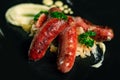 Tasty grilled sausages on slate plate Royalty Free Stock Photo