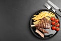 Tasty grilled steak served on black table, flat lay. Space for text Royalty Free Stock Photo