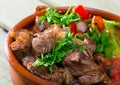 Tasty gyuvech dish of bulgarian cuisine with beef and vegetables at clay pot Royalty Free Stock Photo