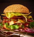 Tasty hÃÂ¾memade delicious burger with guacamole and nachos on a Royalty Free Stock Photo