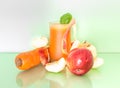 Tasty, healthy juice from fresh carrots and apples. Royalty Free Stock Photo