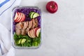 Tasty healthy lunch of vegetables and baked turkey. Salad of red cabbage, spinach, apples, fresh cucumbers with diet meat in a Royalty Free Stock Photo